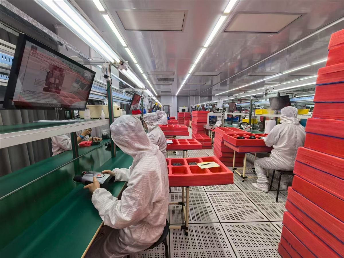 quality control — a technician inspecting a finished unit