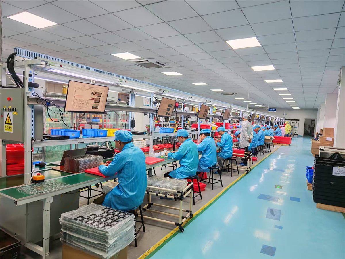 production floor — assembly line stretching into the distance